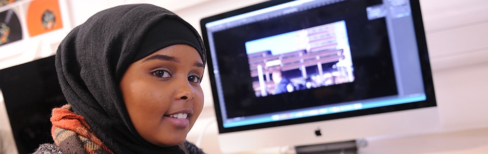 student with her graphic design project